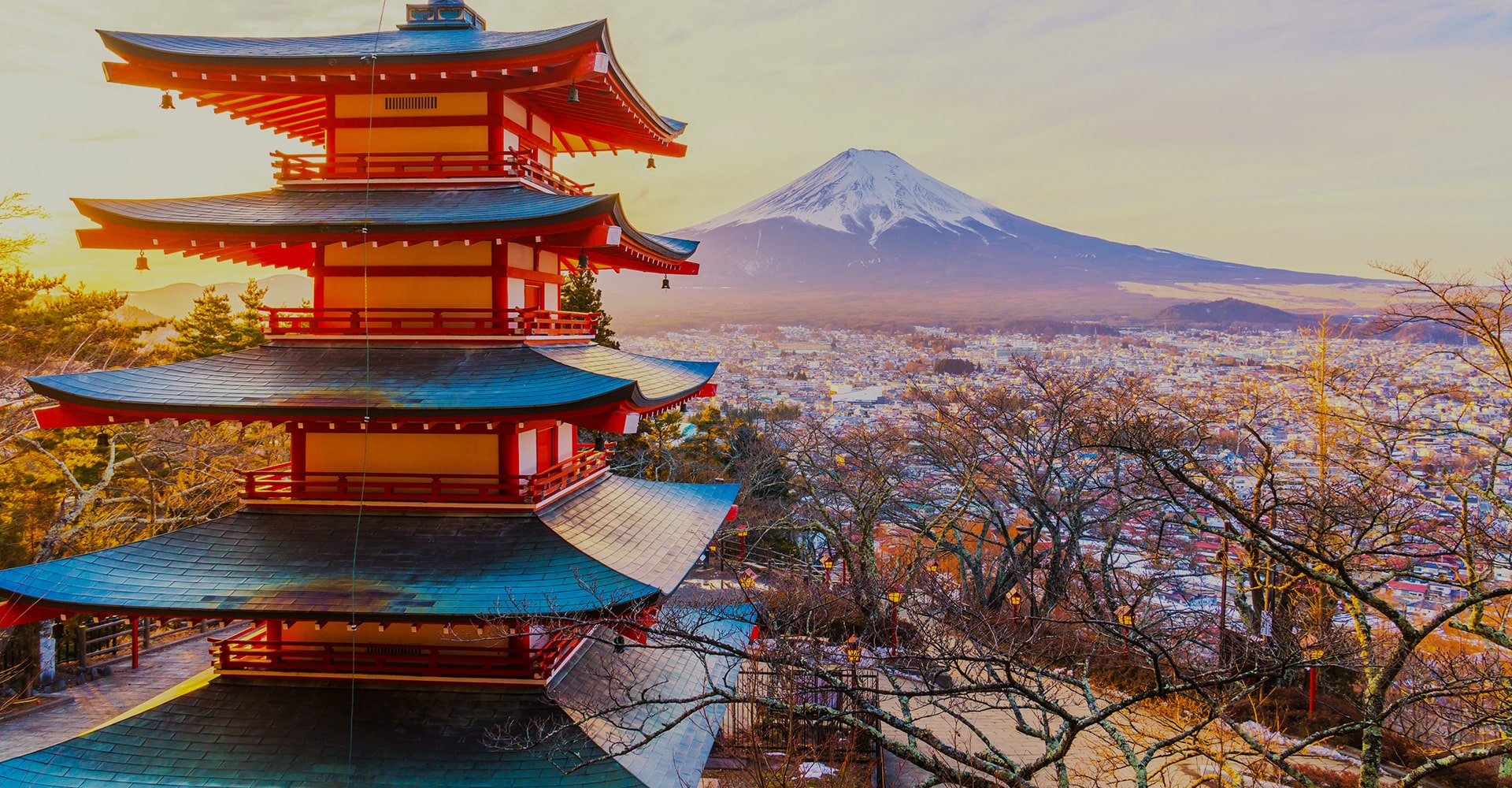 Ornate Japanese Temples, Surrounded by Leafless Trees, Overlooking the Entire Cityscape, with the Iconic Mount Fuji Majestically Rising in the Background.