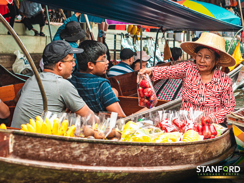 Tourists Exploring Thailand's Floating Market
